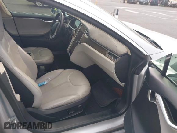 2013 Tesla Model S with VIN 5YJSA1AC3DFP10537, listed as a IAAI auction lot 40707549 with 103,111 mi miles and . Bid and sale history available at DreamBid. Image 5.