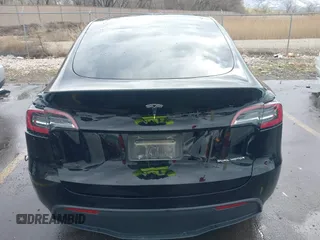 2023 Tesla Model Y Long Range with VIN 7SAYGDEE5PF766685, listed as a IAAI auction lot 41933729 with 25,959 mi miles and . Bid and sale history available at DreamBid. Image 15.
