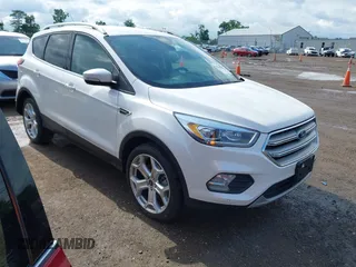 2019 Ford Escape Titanium with VIN 1FMCU9J98KUA95238, listed as a IAAI auction lot 42525324 with 59,222 mi miles and . Bid and sale history available at DreamBid. Image 1.