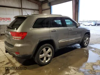 2013 Jeep Grand Cherokee Overland with VIN 1C4RJFCT5DC599866, listed as a Copart auction lot 51837395 with 105,521 mi miles and Salvage Title. Bid and sale history available at carsss.com. Image 3.