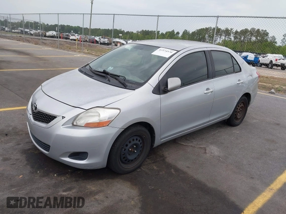 2009 Toyota Yaris with VIN JTDBT903394043218, listed as a IAAI auction lot 41974570 with 281,000 mi miles. Bid and sale history available at carsss.com. Image 2.