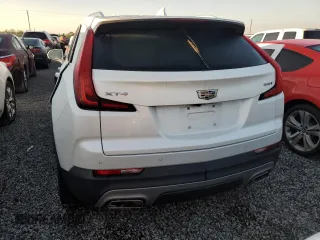 2020 Cadillac XT4 FWD Premium Luxury z VIN 1GYFZCR49LF118146, wystawiony jako Copart lot #82495614 z przebiegiem Nie podano mil oraz Nie do naprawy • Non repairable. Historia ofert i sprzedaży dostępna na DreamBid. Obrazek 6.