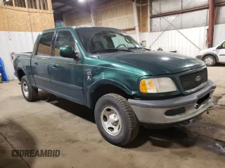 2001 Ford F-150 XLT with VIN 1FTRW08W41KD98737, listed as a Copart auction lot 64695065 with 179,158 mi miles and Clean title. Bid and sale history available at DreamBid. Image 4.