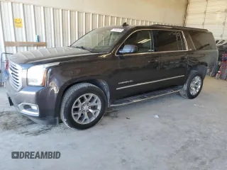 2017 GMC Yukon XL SLT with VIN 1GKS1GKC1HR390673, listed as a Copart auction lot 79182304 with 165,266 mi miles and Salvage Title. Bid and sale history available at carsss.com. Image 1.