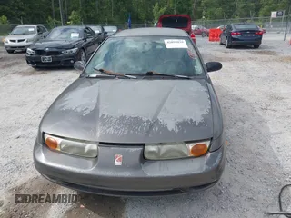 2000 Saturn SL z VIN 1G8ZK527XYZ121984, wystawiony jako IAAI lot #42099839 z przebiegiem 174 210 mil mil oraz . Historia ofert i sprzedaży dostępna na DreamBid. Obrazek 12.
