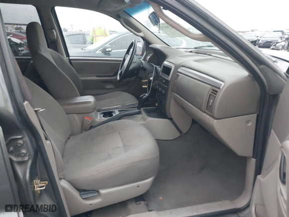 2004 Jeep Grand Cherokee Laredo with VIN 1J4GX48S14C177923, listed as a IAAI auction lot 41745772 with 242,506 mi miles. Bid and sale history available at carsss.com. Image 5.