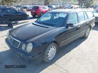2001 Mercedes-Benz E-Class with VIN WDBJH65J31B381879, listed as a IAAI auction lot 41855504 with 153,667 mi miles. Bid and sale history available at carsss.com. Image 2.