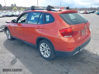 2013 BMW X1 xDrive28i with VIN WBAVL1C58DVR90699, listed as a IAAI auction lot 41809183 with 96,986 mi miles. Bid and sale history available at carsss.com. Image 3.