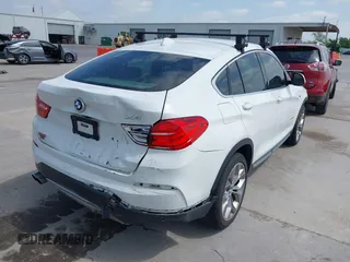 2018 BMW X4 xDrive28i z VIN 5UXXW3C52J0T82067, wystawiony jako IAAI lot #42032671 z przebiegiem 101 331 mil mil oraz . Historia ofert i sprzedaży dostępna na DreamBid. Obrazek 4.
