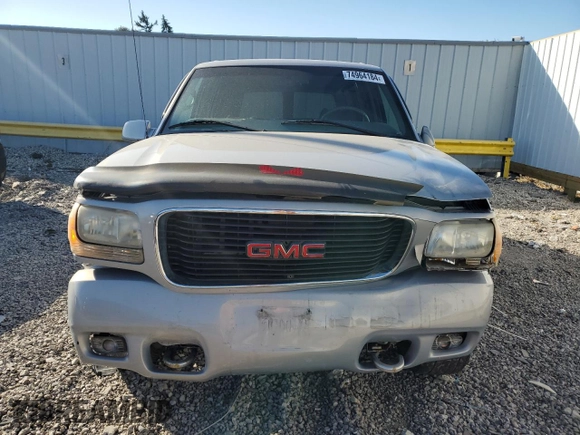 1999 GMC Denali z VIN 1GKEK13R4XR918005, wystawiony jako Copart lot #74964184 z przebiegiem 206 584 mil mil oraz Nie do naprawy. Historia ofert i sprzedaży dostępna na DreamBid. Obrazek 5.