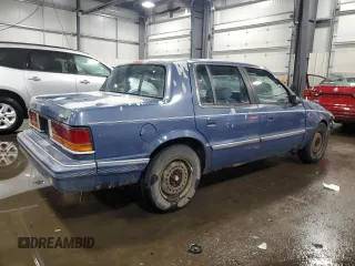 1991 Dodge Spirit z VIN 1B3XA46K9MF628235, wystawiony jako Copart lot #83581274 z przebiegiem 117 774 mil mil oraz Szkody całkowita. Historia ofert i sprzedaży dostępna na DreamBid. Obrazek 3.