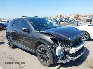 2016 Mazda CX-5 Grand Touring z VIN JM3KE2DY1G0615647, wystawiony jako IAAI lot #42380092 z przebiegiem 199 684 mil mil oraz . Historia ofert i sprzedaży dostępna na DreamBid. Obrazek 1.