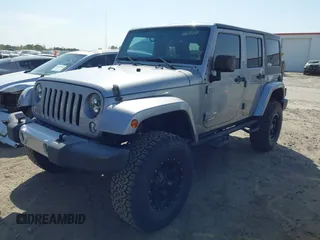 2015 Jeep Wrangler Unlimited Sahara with VIN 1C4BJWEG2FL558860, listed as a IAAI auction lot 41937360 with 113,627 mi miles. Bid and sale history available at carsss.com. Image 18.