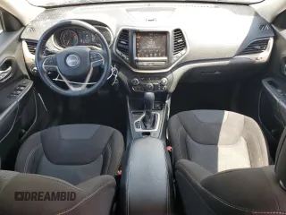 2016 Jeep Cherokee Altitude with VIN 1C4PJLCB8GW207480, listed as a Copart auction lot 62026585 with 124,229 mi miles and Salvage title. Bid and sale history available at DreamBid. Image 8.