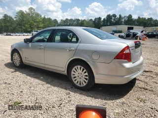 2010 Ford Fusion Hybrid с VIN 3FADP0L33AR171285, выставлен на аукционе Copart как лот 64983995 с пробегом 166 596 миль миль и Чистый • Clean title. История ставок и продаж доступна на DreamBid. Изображение 2.