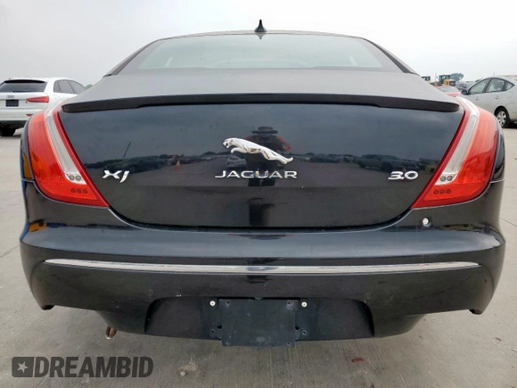 2015 Jaguar XJ with VIN SAJWA1CZ8F8V85381, listed as a Copart auction lot 57464225 with 161,938 mi miles and Salvage Title. Bid and sale history available at DreamBid. Image 6.