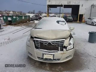 2014 Cadillac XTS Luxury z VIN 2G61M5S37E9304598, wystawiony jako IAAI lot #41006051 z przebiegiem 115 879 mil mil oraz . Historia ofert i sprzedaży dostępna na DreamBid. Obrazek 12.