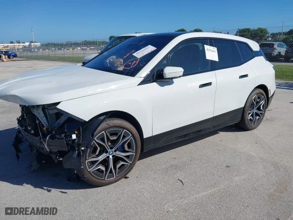2025 BMW iX xDrive50 with VIN WB523CF02SCT10334, listed as a IAAI auction lot 40396663 with 971 mi miles. Bid and sale history available at carsss.com. Image 18.