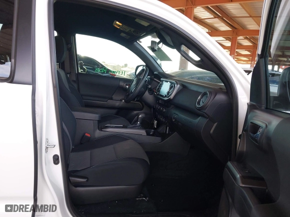 2023 Toyota Tacoma 4WD SR with VIN 3TMCZ5AN8PM650793, listed as a IAAI auction lot 41664712 with 9,427 mi miles. Bid and sale history available at carsss.com. Image 5.