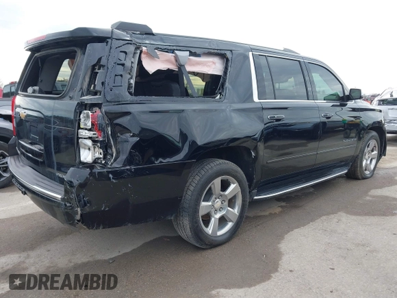 2019 Chevrolet Suburban Premier with VIN 1GNSKJKC7KR261826, listed as a IAAI auction lot 41652451 with 127,032 mi miles and . Bid and sale history available at DreamBid. Image 4.