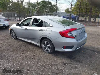 2019 Honda Civic Sedan LX with VIN 2HGFC2F65KH586106, listed as a IAAI auction lot 40486735 with 82,714 mi miles. Bid and sale history available at carsss.com. Image 3.