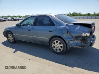 2000 Toyota Camry CE with VIN JT2BG22K9Y0521639, listed as a Copart auction lot 55075485 with 248,460 mi miles and Salvage Title. Bid and sale history available at carsss.com. Image 2.
