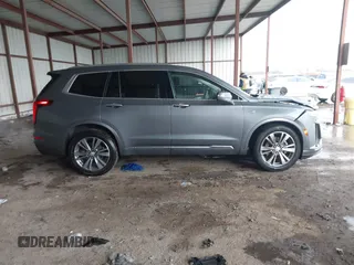 2022 Cadillac XT6 Premium Luxury z VIN 1GYKPDRS1NZ108012, wystawiony jako IAAI lot #41178333 z przebiegiem 83 987 mil mil oraz . Historia ofert i sprzedaży dostępna na DreamBid. Obrazek 13.