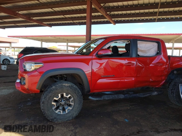 2018 Toyota Tacoma SR with VIN 3TMCZ5AN8JM141486, listed as a IAAI auction lot 42142145 with 54,851 mi miles and . Bid and sale history available at DreamBid. Image 14.
