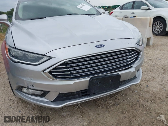 2017 Ford Fusion SE z VIN 3FA6P0HD5HR166433, wystawiony jako IAAI lot #42394998 z przebiegiem 121 333 mil mil oraz . Historia ofert i sprzedaży dostępna na DreamBid. Obrazek 6.