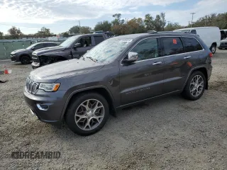 2021 Jeep Grand Cherokee Overland with VIN 1C4RJFCG9MC620320, listed as a Copart auction lot 85609814 with 61,335 mi miles and Salvage Title. Bid and sale history available at carsss.com. Image 1.