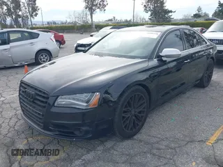2013 Audi S8 with VIN WAUD2AFD0DN028673, listed as a IAAI auction lot 41689320 with 115,502 mi miles. Bid and sale history available at carsss.com. Image 2.