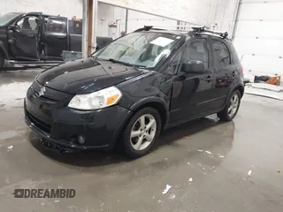 2009 Suzuki SX4 Man AWD with VIN JS2YB413596200885, listed as a IAAI auction lot 41189776 with 111,891 mi miles. Bid and sale history available at carsss.com. Image 2.