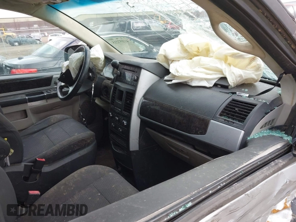 2010 Dodge Grand Caravan SXT with VIN 2D4RN5D13AR180609, listed as a IAAI auction lot 41857215 with Not Provided miles and . Bid and sale history available at DreamBid. Image 5.