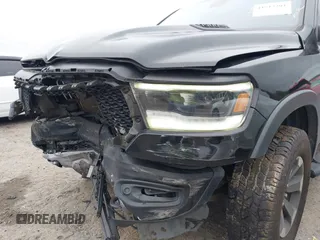 2019 Ram 1500 Rebel z VIN 1C6SRFLT1KN722064, wystawiony jako IAAI lot #41513201 z przebiegiem 113 559 mil mil oraz . Historia ofert i sprzedaży dostępna na DreamBid. Obrazek 22.