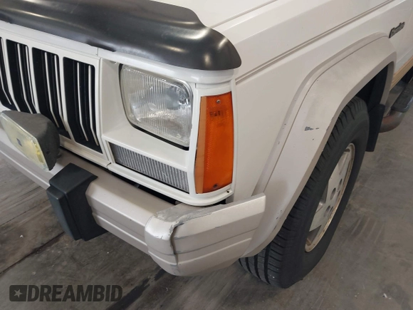 1996 Jeep Cherokee Country with VIN 1J4FT78S5TL232090, listed as a IAAI auction lot 42267272 with 255,417 mi miles and . Bid and sale history available at DreamBid. Image 6.