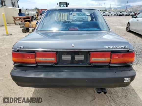 1990 Toyota Camry z VIN JT2VV21E2L0114723, wystawiony jako Copart lot #53584755 z przebiegiem 58 986 mil mil oraz Czysty tytuł • Clean title. Historia ofert i sprzedaży dostępna na DreamBid. Obrazek 6.