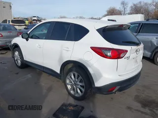 2015 Mazda CX-5 Grand Touring with VIN JM3KE4DY3F0483629, listed as a IAAI auction lot 41054059 with 118,980 mi miles. Bid and sale history available at carsss.com. Image 3.