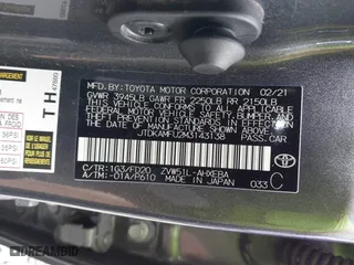 2021 Toyota Prius L Eco with VIN JTDKAMFU2M3143138, listed as a IAAI auction lot 41658263 with 102,718 mi miles. Bid and sale history available at carsss.com. Image 9.