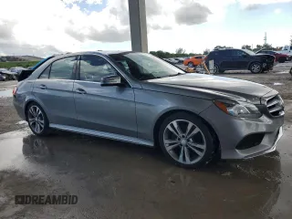 2014 Mercedes-Benz E 350 Sport with VIN WDDHF5KB7EA823075, listed as a Copart auction lot 56886345 with 122,892 mi miles and Salvage title. Bid and sale history available at DreamBid. Image 4.