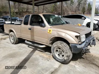 1999 Toyota Tacoma with VIN 4TAWN72NXXZ563507, listed as a Copart auction lot 49888575 with 387,818 mi miles and Salvage title. Bid and sale history available at DreamBid. Image 4.