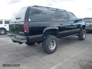 1999 Chevrolet Suburban with VIN 3GNFK16R6XG252736, listed as a IAAI auction lot 41897003 with 140,081 mi miles. Bid and sale history available at carsss.com. Image 4.