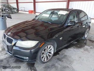 2011 BMW 3 Series 328i xDrive with VIN WBAPK5C52BA656871, listed as a IAAI auction lot 41990593 with 152,452 mi miles. Bid and sale history available at carsss.com. Image 2.