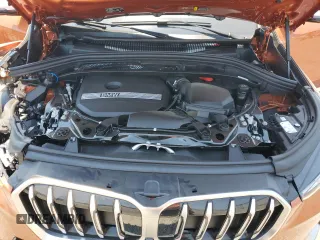 2023 BMW X1 xDrive28i with VIN WBX73EF03P5W54209, listed as a Copart auction lot 64796365 with 19,591 mi miles and Salvage title. Bid and sale history available at DreamBid. Image 12.