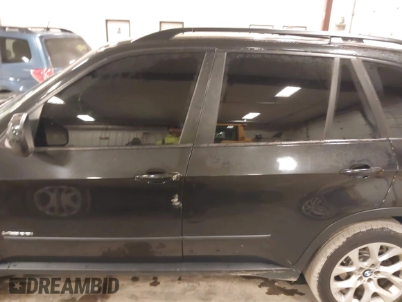 2012 BMW X5 35i with VIN 5UXZV4C55CL990510, listed as a IAAI auction lot 41849293 with 117,522 mi miles and . Bid and sale history available at DreamBid. Image 14.