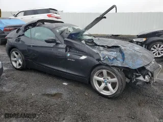2011 BMW Z4 sDrive30i with VIN WBALM5C56BE379790, listed as a Copart auction lot 80991153 with 0 mi miles and Salvage Title. Bid and sale history available at carsss.com. Image 4.