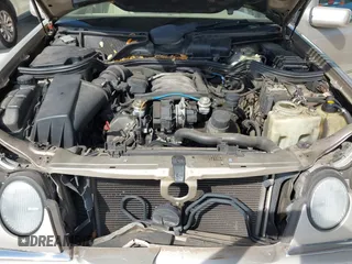 1999 Mercedes-Benz E-Class with VIN WDBJH65F3XA845635, listed as a IAAI auction lot 42102122 with 215,678 mi miles. Bid and sale history available at carsss.com. Image 10.