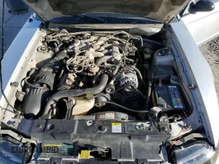 2003 Ford Mustang Standard z VIN 1FAFP40463F327722, wystawiony jako Copart lot #55042765 z przebiegiem 117 010 mil mil oraz Szkoda całkowita • Salvage title. Historia ofert i sprzedaży dostępna na DreamBid. Obrazek 11.