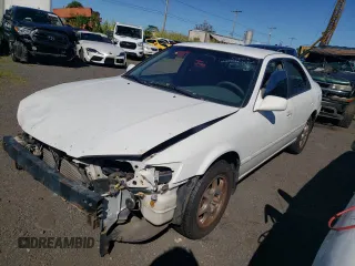 2001 Toyota Camry LE z VIN JT2BF22K410331806, wystawiony jako Copart lot #82933114 z przebiegiem 124 579 mil mil oraz Szkoda całkowita • Salvage title. Historia ofert i sprzedaży dostępna na DreamBid. Obrazek 1.