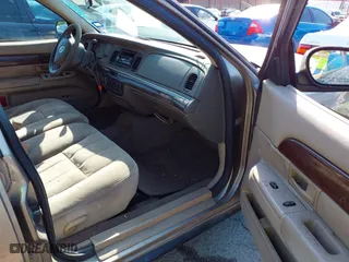 2003 Mercury Grand Marquis GS Convenience with VIN 2MEFM74W43X662724, listed as a IAAI auction lot 42036847 with 234,008 mi miles. Bid and sale history available at carsss.com. Image 5.