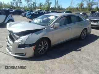 2014 Cadillac XTS z VIN 2G61L5S39E9159583, wystawiony jako IAAI lot #36024597 z przebiegiem 118 461 mil mil oraz . Historia ofert i sprzedaży dostępna na DreamBid. Obrazek 2.